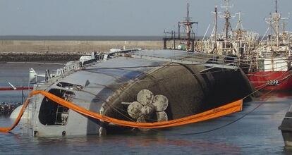 The Argentinean destroyer ARA Sant&iacute;sima Trinidad lies on its side in Puerto Belgrano.