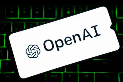 OpenAI logo is seen on a smartphone screen over a keyboard. (Photo by Nikos Pekiaridis/NurPhoto via Getty Images)