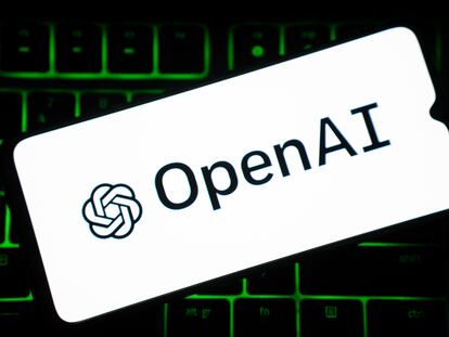 OpenAI logo is seen on a smartphone screen over a keyboard. (Photo by Nikos Pekiaridis/NurPhoto via Getty Images)