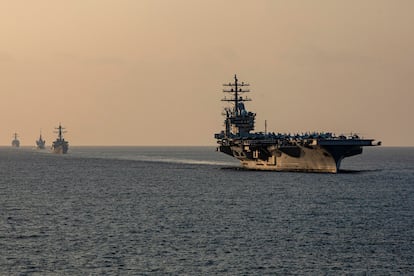 Components of the Dwight D. Eisenhower Carrier Strike Group transit the Strait of Hormuz November 25, 2023.