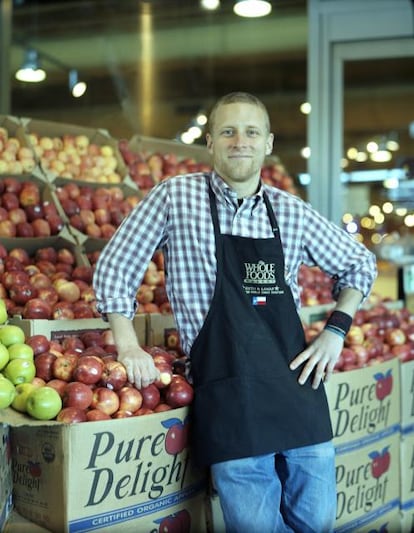 Team-member-in-front-of-produce