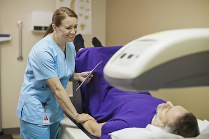 A bone-mineral density test is performed on a patient.
