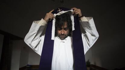 Father Teo Nieto prepares for one of the 624 masses he holds each year.