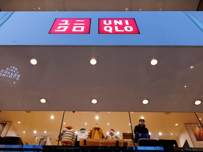 FILE PHOTO: A shopper looks on, inside a Fast Retailing's Uniqlo casual clothing store in Tokyo, Japan January 11, 2023. REUTERS/Issei Kato/File Photo