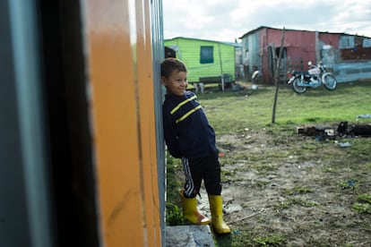 A child waits outside the facilities where classes are held, in April 2024. 