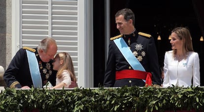 Juan Carlos embraces granddaughter Leonor on the day his son was crowned Felipe VI.