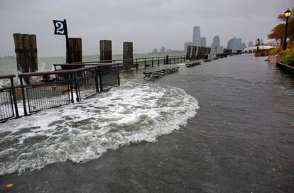 Waves wash over the seawall near high tide at Battery Park in New York, Oct. 29, 2012, as Hurricane Sandy approaches the East Coast