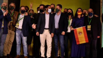 Vox  leader Santiago Abascal (front row, third from right) with regional candidate Ignacio Garriga after learning that the far-right group has entered the regional parliament with 11 seats. 