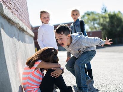 sad moment Elementary Age Bullying in Schoolyard