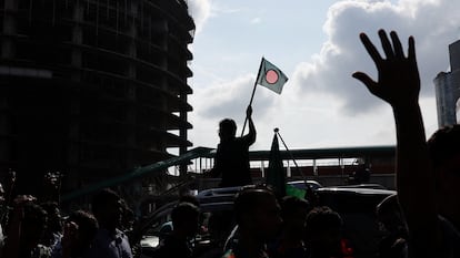 People celebrate the resignation of Bangladesh Prime Minister Sheikh Hasina in Dhaka. 