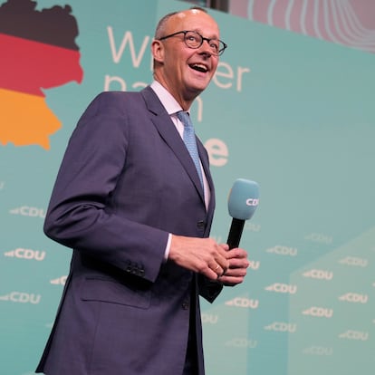 Friedrich Merz, the candidate of the mainstream conservative Christian Democratic Union party, arrives on stage to address supporters at the party headquarters in Berlin, Germany, Sunday, Feb. 23, 2025, after the German national election. (AP Photo/Markus Schreiber)