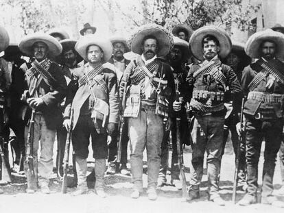 Pancho Villa, Mexican bandit and revolutionary leader, lined up with some of his followers.