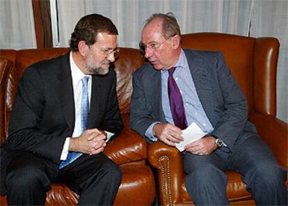 Mariano Rajoy y Rodrigo Rato, en una conferencia en el Club Siglo XXI.