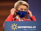 European Commission President Ursula von der Leyen puts on her protective face mask at the conclusion of a media conference at an EU summit in Porto, Portugal, Saturday, May 8, 2021. On Saturday, EU leaders held an online summit with India's Prime Minister Narendra Modi, covering trade, climate change and help with India's COVID-19 surge. (AP Photo/Luis Vieira)