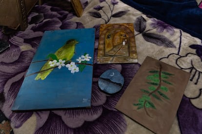 Some of the drawings of young refugee Rahif Almeari on the pieces of wood that his father prepares. In addition to Palestinian symbols, the teen also paints nature scenes and landscapes.