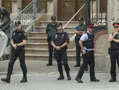 Officers with the Civil Guard, National Police and regional Catalan Mossos d’Esquadra forces in Barcelona.