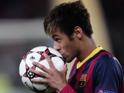 Barcelona forward Neymar kisses the match ball after his hat-trick against Celtic. 