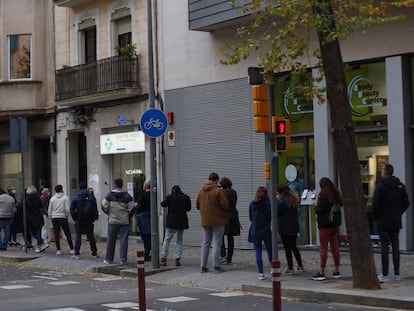 People wait in line for a coronavirus test at a private clinic in Spain.