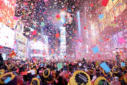 Confetti flies around Times Square as people welcome the New Year, on January 1, 2023.