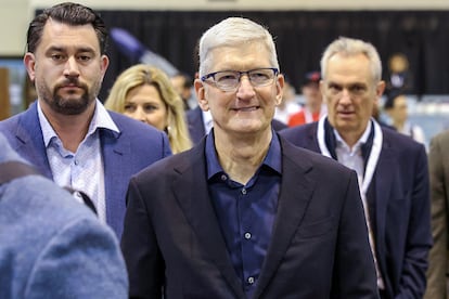 Apple CEO Tim Cook arrives for the Berkshire Hathaway shareholder meeting.