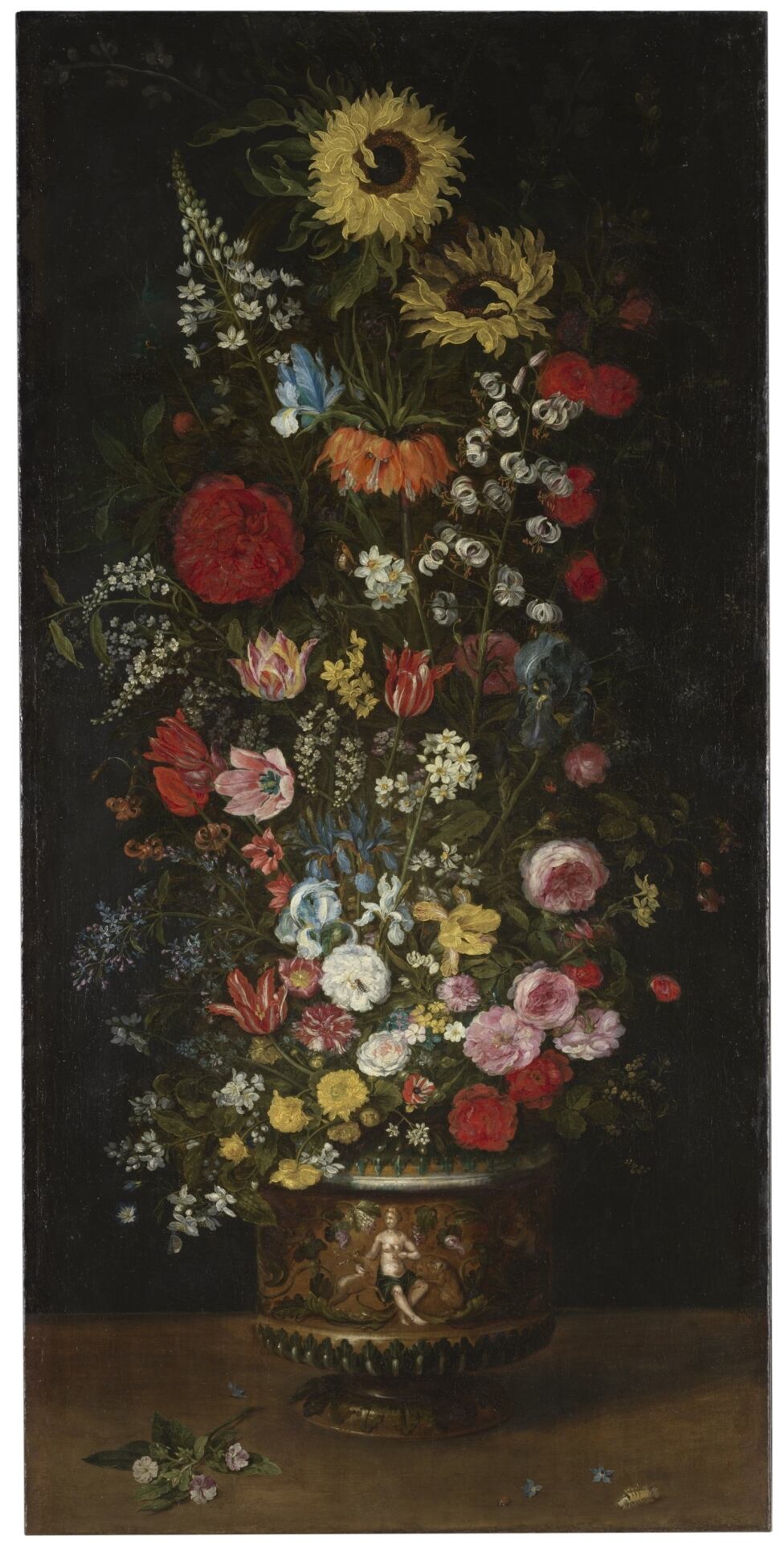 Los dos girasoles que coronan este cuadro titulado 'Florero', en el Museo del Prado, muestran la viveza y naturalidad con la que Jan Brueghel retrataba las flores