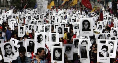 Demonstrators march in Santiago, Chile on Sunday.