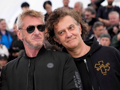 Sean Penn, left, and director Jean-Stephane Sauvaire pose for photographers at the photo call for the film 'Black Flies' at the 76th Cannes Film Festival.