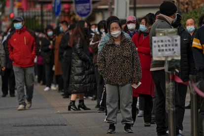 People wait in long lines for mandatory PCR Covid tests.