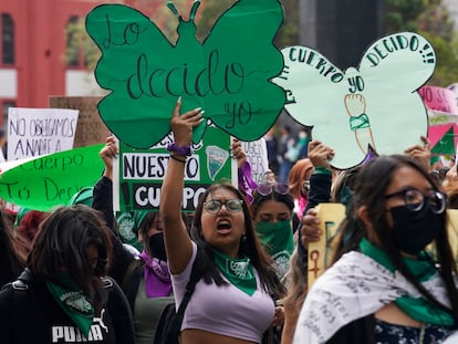 A woman holds up a sign during a march demanding legal, free, and safe abortions for all women, marking International Safe Abortion Day, in Mexico City, Sept. 28, 2022.