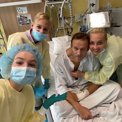 Russian opposition politician Alexei Navalny and his family members pose for a picture at Charite hospital in Berlin, Germany, in this undated image obtained from social media September 15, 2020. 