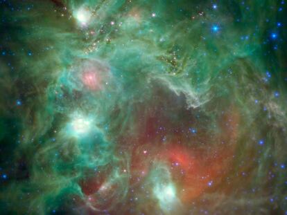 An image of the star-forming region NGC 2174, captured by NASA's Spitzer Space Telescope. It reveals dozens of young stars shrouded in dust.