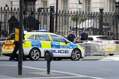 Police at the scene after a car collided with the gates of Downing Street in London