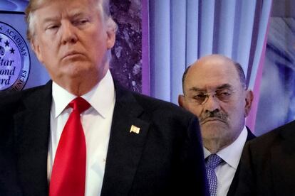 Allen Weisselberg, right, stands behind then President-elect Donald Trump during a news conference in the lobby of Trump Tower in New York, Jan. 11, 2017.