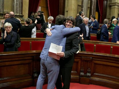 Catalan premier Carles Puigdemont and fellow separatists celebrating the vote.