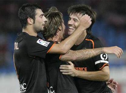 Los jugadores del Valencia festejan un gol