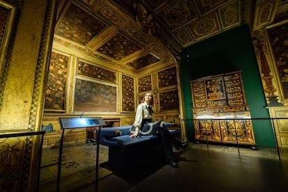 A museum assistant poses within a Parisian "cabinet" room from the reign of Louis XVI, within the Victoria and Albert museum's new "1600-1815" galleries in London on December 7, 2015. The V&A's seven new gallery areas hold nearly 1,100 objects and will open to the public on 9 December, 2015. 
AFP PHOTO / LEON NEAL