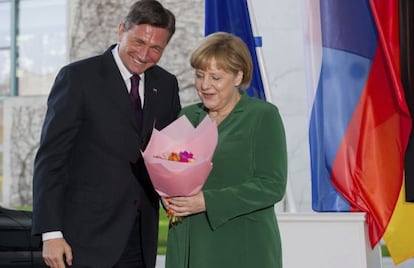 El presidente esloveno, Borut Pahor, con  &Aacute;ngela Merkel.
