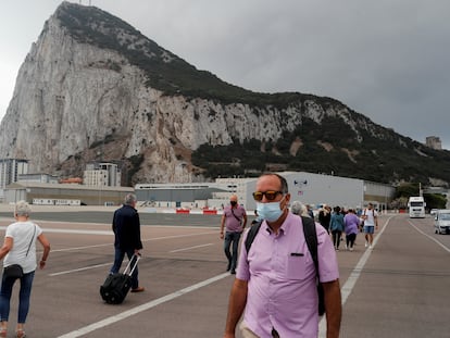 People crossing the runway at Gibraltar airport.