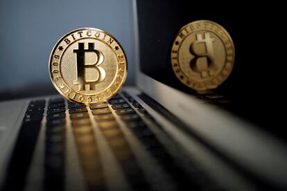 A bitcoin is seen in an illustration picture taken at La Maison du Bitcoin in Paris, France