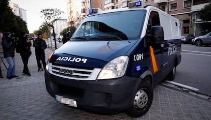 A police van brings three of the defendants to court.