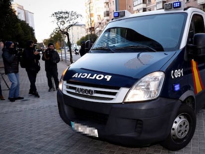 A police van brings three of the defendants to court.