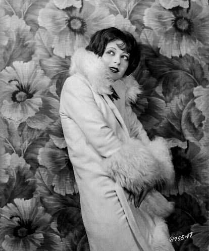 Portrait of actress Clara Bow (1905-1965), wearing a fur-trimmed robe, for Paramount Pictures, 1926.