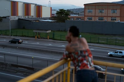 A person living with HIV looks out over the city, in Nova Iguacu, Brazil.