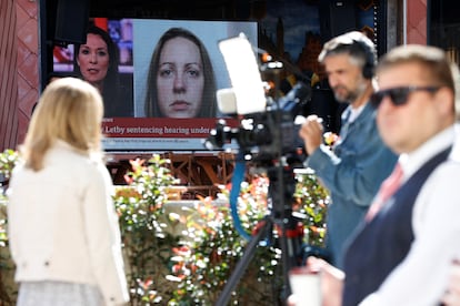 Members of the media work near a large screen showing a picture of convicted hospital nurse Lucy Letby, ahead of her sentencing, outside the Manchester Crown Court, in Manchester, Britain, August 21, 2023.