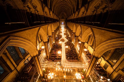 SALISBURY, ENGLAND - NOVEMBER 25: (EDITORS NOTE A MULTIPLE LONG EXPOSURE WAS USED IN THE CREATION OF THIS IMAGE) In this combination of two images the interior of Salisbury Cathedral is illuminated by trails of candles carried by choristers during the annual 'darkness to light' advent procession on November 25, 2016 in Salisbury, England. The service, which begins with the medieval cathedral in total darkness and silence before the Advent Candle is lit at the West End, is one of the most popular services of the liturgical year. The annual advent service, which also takes place over tonight and tomorrow night and is seen by several thousand people, is a mix of music and readings during which two great candlelit processions move around the different spaces in the over 750-year-old building which, by the end, is illuminated by almost 1300 candles and is a spectacular start to the Christmas season. (Photo by Matt Cardy/Getty Images)