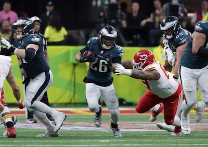 Philadelphia Eagles running back Saquon Barkley with the ball during a Super Bowl play.