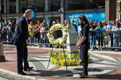 Massachusetts Governor Charlie Baker and Boston Mayor Michelle Wu observe a moment of silence at the site of the Boston Marathon bombing memorial at 671 Boylston Street