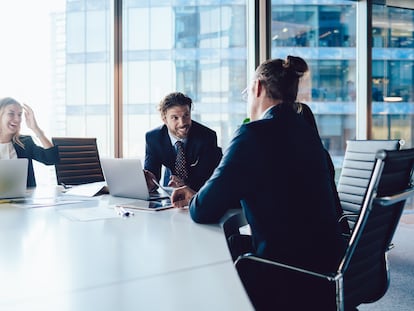 Successful male and female crew of financial experts have cooperation meeting at office table for discussing project planning, professional executive managers consultancy and brainstorming in firm