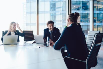 Successful male and female crew of financial experts have cooperation meeting at office table for discussing project planning, professional executive managers consultancy and brainstorming in firm