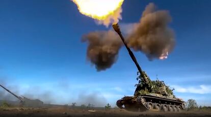 This photo taken from video released by Russian Defense Ministry Press Service on June 5, 2023, shows a Russian self-propelled gun firing towards Ukrainian positions at an undisclosed location.